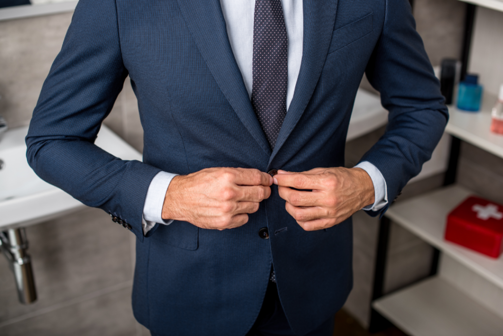 cropped-image-of-businessman-buttoning-up-suit-jac-2024-11-18-06-46-03-utc